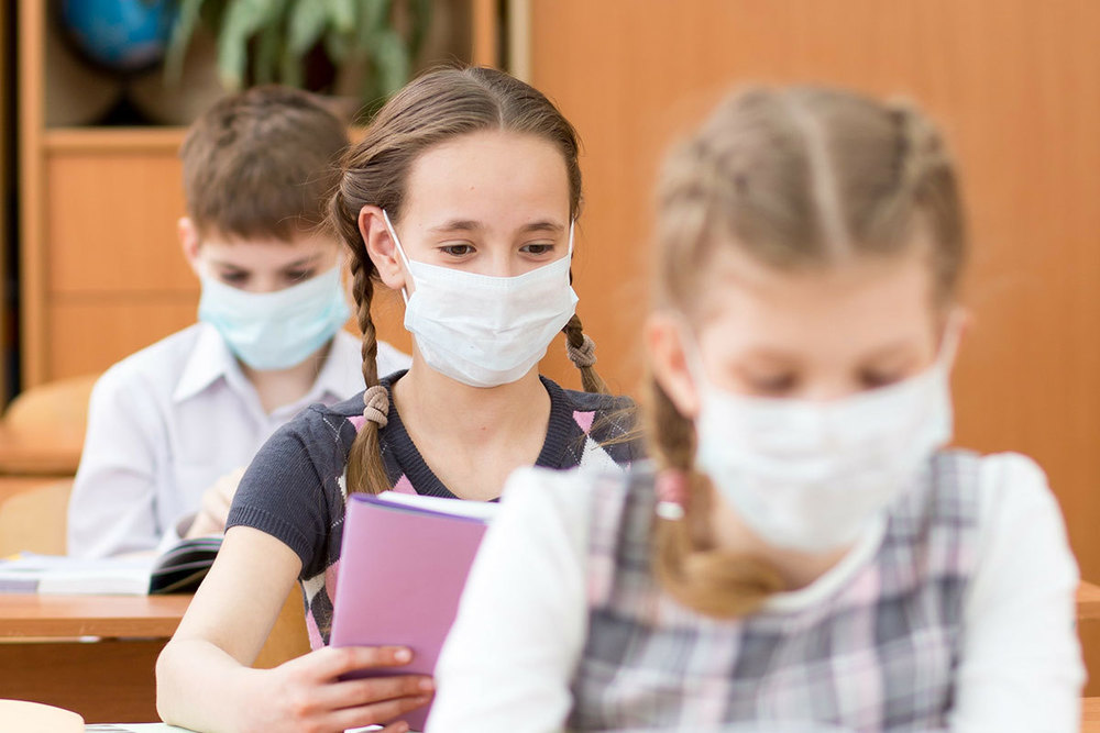 Students in masks at desks