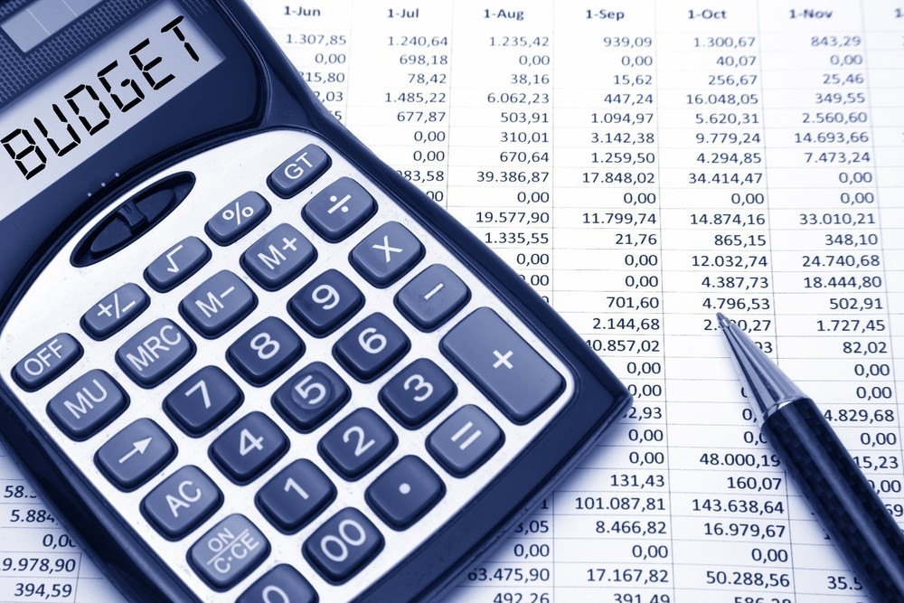 Calculator with budget page and pen
