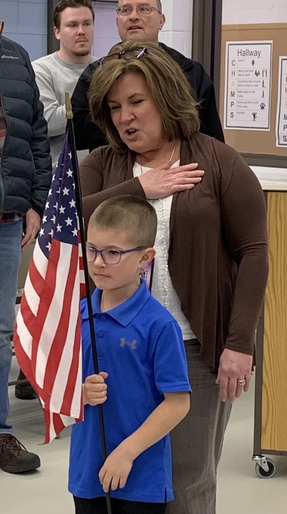 Kindergarten Student Lawsyn B leads the pledge of allegiance