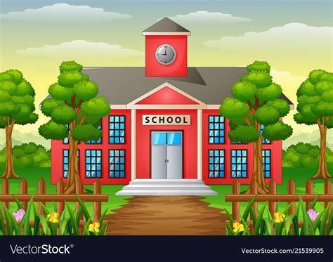 School house with trees and a wooden fence in front