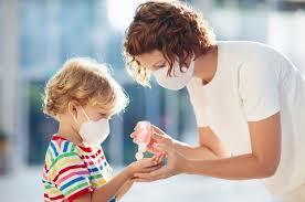 Mother & Child in Masks with Hand Sanitizer