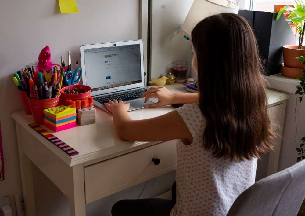 Student at desk on computer