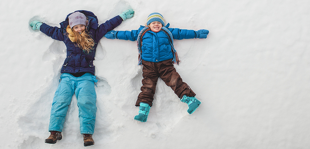 Kids making snow angels