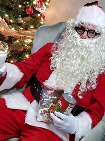 Santa with food pantry items